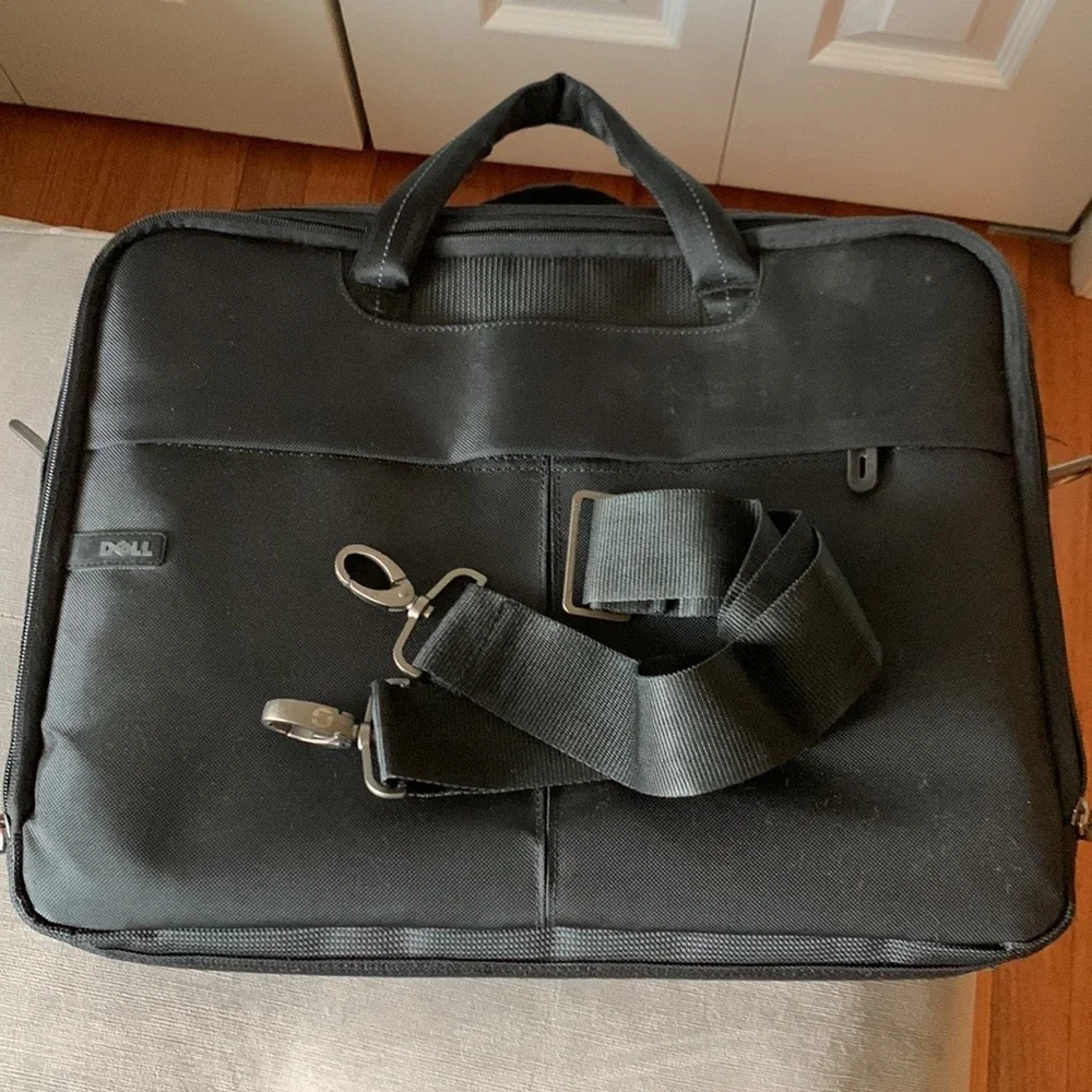 Computer/laptop bag with removable adjustable straps. Lots of compartments